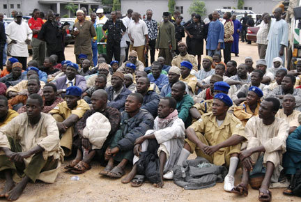 Alleged members of Boko Haram sit after their arrest in Kano in northern Nigeria by police on 27 July 2009(Photo: Reuters/Afolabi Sotunde)