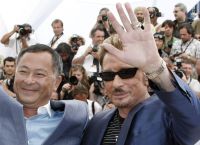 Film director Johnnie To with Johnny Hallyday at the Cannes film festival to present Vengeance which showcased Hallyday's acting skills(Photo: Reuters)