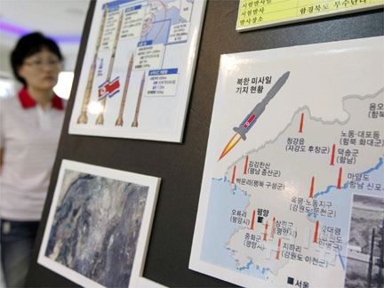 A tourist looks at a display showing North Korea's missile system at a South Korean observation post near the demilitarized zone separating the two Koreas.(Photo: Reuters)