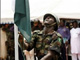 A Nigerian soldier lowers the Nigerian flag.(Photo: Dibussi Tande/Wikimedia Commons) 
