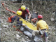 Rescuers transport wrapped bodies from the crash scene of a helicopter Pingtung County.(Photo: Reuters)