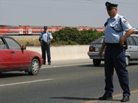 Israeli police stop cars outside of Lot, 13 August 2009(Photo: Reuters)