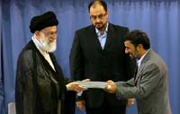 Iranian President Mahmoud Ahmadinejad (R) receives a certificate declaring him as President of the Islamic Republic of Iran from Supreme Leader Ayatollah Ali Khamenei (L) in Tehran 3 August , 2009. (Photo: Reuters)