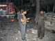 Security officials at the site of the bomb blast in Kandahar, 25 August 2009(Photo: Reuters)