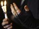 A Shia-Muslim pilgrim holds candles during a religious ceremony to mark the birth of Imam al-Mehdi.(Photo : Reuters)