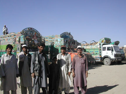 Lorry drives in front of their elaborately decorated lorries at a lorry park on the road to Loghar(Photo: Tony Cross)