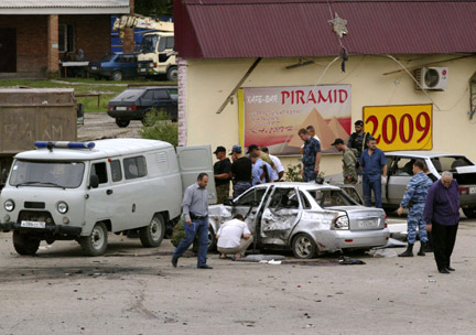 Tuesday's killing of four policemen follows a suicide attack on Zhukovsky street in central Grozny on 21 August, 2009, in which four police officers also died when two suicide bombers on bicycles blew themselves up. (Photos: Reuters/Khamzad Ibragimov)