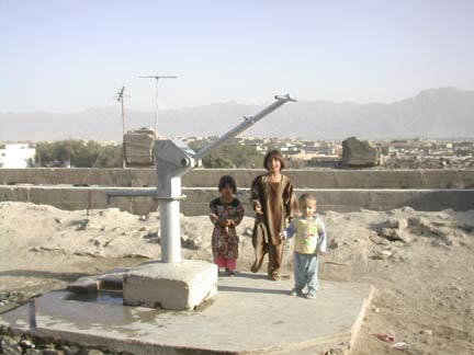 Children play at Shah Shaheen's water pump(Photo: Tony Cross)