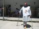 A disabled election worker at Qala-e-Fatullah polling station, Kabul - many Afghans have lost limbs in decades of war(Photo: Tony Cross/RFI)