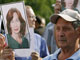 Supporters hold portraits of murdered human rights activist Natalia Estemirova at a memorial in Moscow on July 16, 2009. Chechen President Ramzan Kadyrov this week denied any involvement in her murder(Photo : Reuters/Denis Sinyakov)