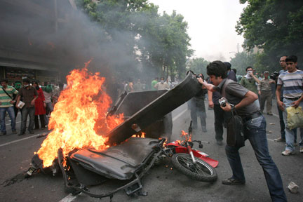 Supporters of Mousavi set fire during post-election unrest. (Photo: Reuters)