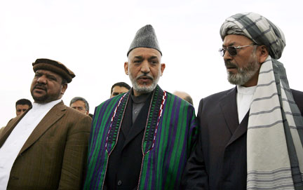 Hamid Karzai (C) with his running mates Mohammed Qasim Fahim (L) and Vice-President Karim Khalili(Photo: Reuters)