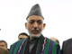 Hamid Karzai (C) with his running mates Mohammed Qasim Fahim (L) and Vice-President Karim Khalili(Photo: Reuters)