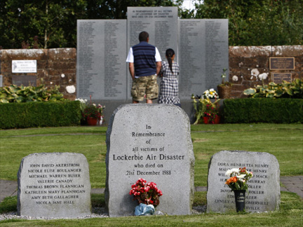 A couple at the main headstone in the Lockerbie memorial garden, in south west Scotland, on Thursday.(Photo: Reuters)