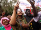 Lubna Hussein (c) joins women demonstrating outside the court after her trial(Photo: Reuters)