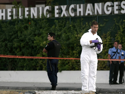 A police expert carries debris(Photo: Reuters)