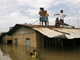 Residents gather on the rooftop of a house in Binan Laguna, south of Manila(Photo: Reuters)
