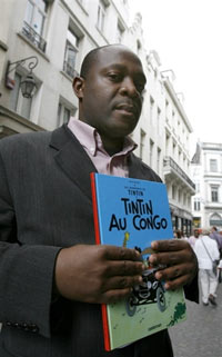 Bienvenu Mbutu Mondondo with the offending volume.(Photo: AFP)
