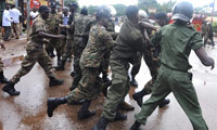 Guinean police arrest a protester on 28 September(Photo: AFP)