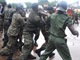 Guinean police arrest a protester on 28 September(Photo : AFP)
