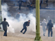 Olympique Marseille fans are repelled by tear gas as police separate them from Paris St Germain fans at the Saint Charles train station in Marseille, 25 October 2009.(Photo: Reuters)