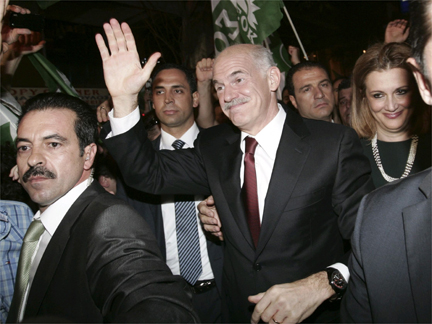 Socialist leader George Papandreou waves to his supporters as Pasok closed in on victory in Greece(Photo: Reuters) 