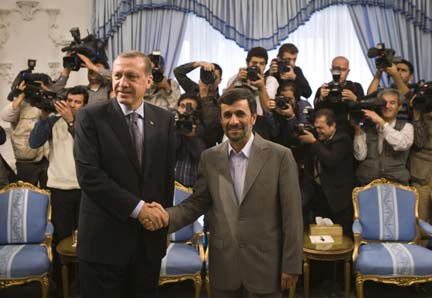 Iran's President Mahmoud Ahmadinejad (R) shakes hands with Turkey's Prime Minister Tayyip Erdogan during a meeting in Tehran (Photo: Reuters)