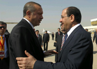 Iraq's Prime Minister Nuri al-Maliki (R) welcomes his Turkish counterpart Recep Tayyip Erdogan at Baghdad International Airport on Thursday(Photo: Reuters)