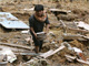 A man in the ruins of his house that was burried in a landslide, Padang Pariaman, 5 October 2009(Photo: Reuters)