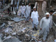 Men return to collect their belongings from their destroyed markets in Peshawar October 29, 2009(Photo: Reuters)