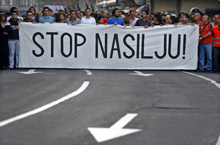 Thousands of people carry a banner reading "Stop the violence", as they march in Belgrade on 1 October, 2009. The demonstration took place on a day of mourning held for Toulouse supporter Brice Taton. (Photo: Reuters)