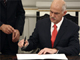 New Greek Prime Minister George Papandreou signs decree in Athens on 6 October 2009(Photo: Reuters)