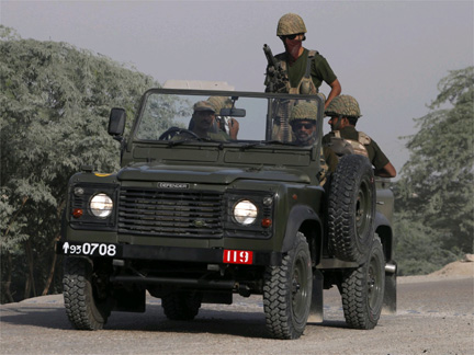 Soldiers patrol near a check post along the road leading from South Waziristan to Dera Ismail Khan, in the North West Frontier Province(Photo: Reuters)
