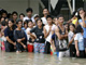 Residents in Pateros, east of the capital Manila, stand in floodwaters brought about by Typhoon Ketsana on 30 September, 2009(Photos: Reuters)