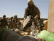 US Marines pour gasoline on bags of confiscated poppy seeds in Helmand province(Credit: Reuters)