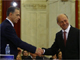 Romania's incumbent President Traian Basescu (R) shakes hands with Mircea Geoana (L).(Photo: Reuters)