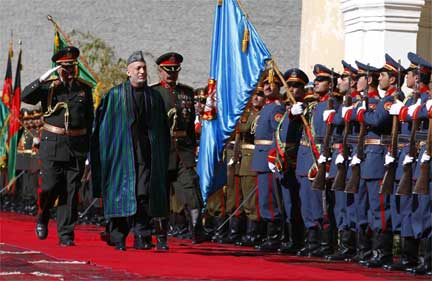 Hamid Karzai inspects the guard of honour before his inauguration as President in Kabul, 19 November 2009.(Photo: Jerry Lampen/Reuters)