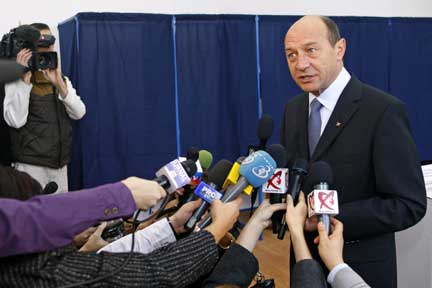 Romania's President Traian Basescu talks to the media after voting in Bucharest(Photo: Reuters)