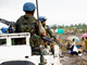UN soldiers pass near a UN mission in DR Congo (MONUC) base at Kiwanja, about 80 km north of Goma(Photo: AFP)
