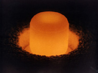 A plutonium pellet glows under its own light(Photo: US Department of Energy)
