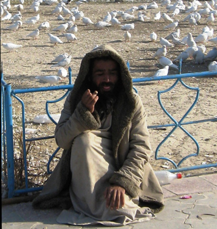 Beggars in front of Mazar-e-Sharif's Blue Mosque.Photo: Manuel Pochez