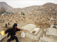 A boy runs through a cemetery in Kabul

(Photo: Reuters)