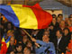 Trajan Basescu waves the Romanian flag after the first exit polls, 6 December 2009(Photo: Bogdan Cristel/Reuters)