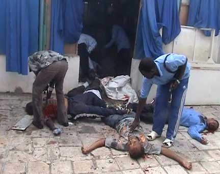 Bodies are examined after an explosion at the Hotel Shamo in Mogadishu in this video grab(Photo: Reuters)