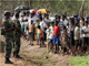 Soldiers and Tamils at a displaced persons camp, Vavuniya, 21 November 2009(Photo: Reuters)