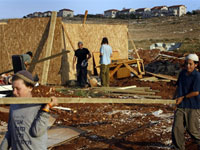 Jewish settlers rebuild their illegal outpost next to Kokhav Ha Shahar settlement in the West Bank in May(Photo: AFP)