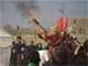 Actors re-enact the 7th century battle of Kerbala during the "Taziyeh" religious theatre performance on Tasoua, a day before Ashura, in Yazd, about 700 km south of Tehran, on Saturday. (Photo: Reuters)