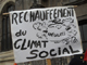 A placard reading <em>Social Climate Change</em> at the Flash Mob in Paris on 5 December