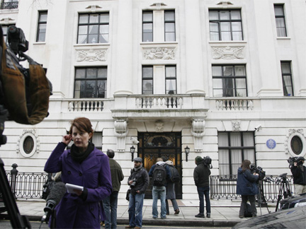 The media outside a property in London on Saturday, where police are searching in connection with a failed attempt by a man to ignite an explosive device on a U.S. passenger plane. (Photo: Reuters)