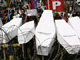 Protesters in Manila display coffins made of cardboard at a protest against the brutal killing of 57 people in Maguindanao in November.Photo: Reuters/Romeo Ranoco